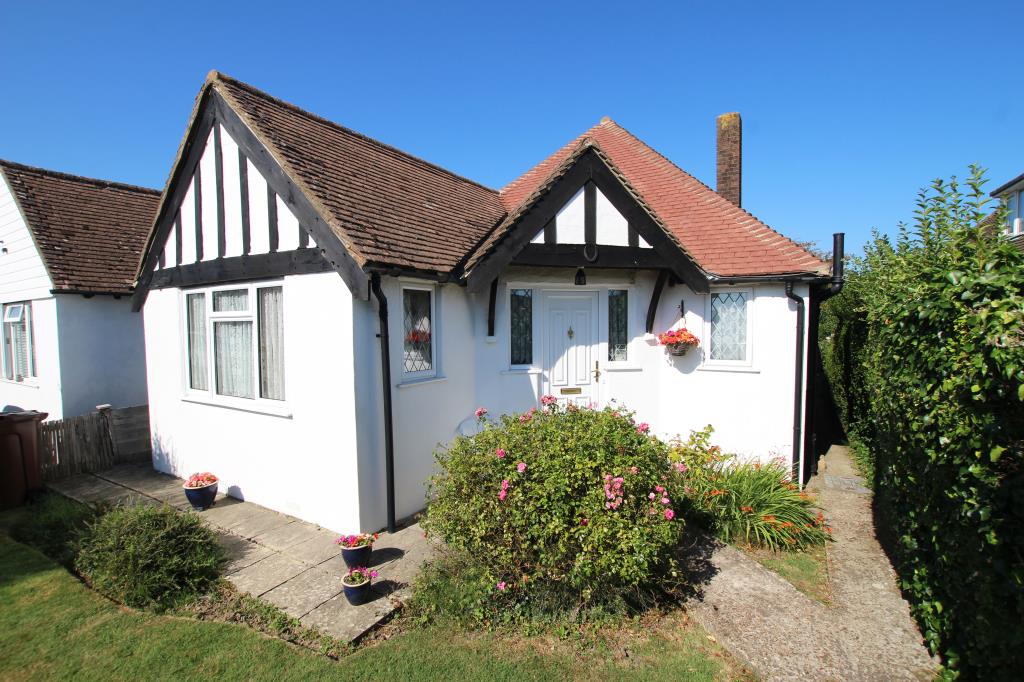 Lot: 129 - DETACHED BUNGALOW LET ON REGULATED TENANCY - Front elevation - historic photo taken August 2024